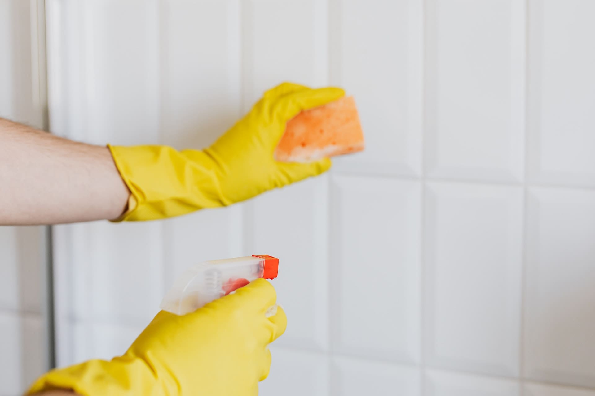 woman cleaning tiles
